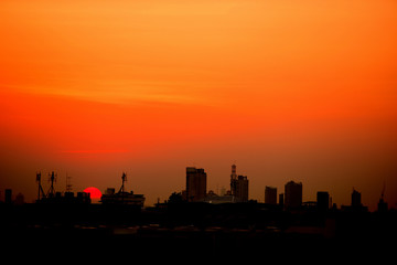 Sunset view Beautiful golden yellow sky in big cities