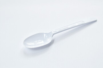 plastic spoon for single used on white background