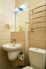 bathroom with washbasin, with light above the mirror