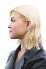 Close up profile portrait of an attractive, woman with blonde hair and a serious expression