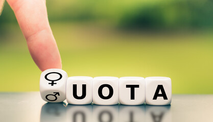 Symbol for women's quota. Hand turns a dice and changes the expression of 