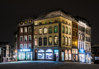 Snowy empty street at night in Aachen, Germany