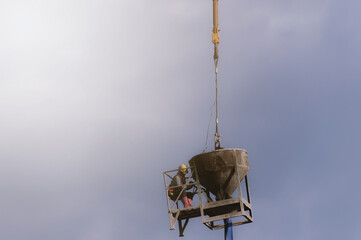 City worker, construction crews to work on high ground heavy industry and safety concept over blurred natural background sunset 