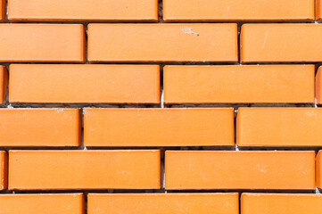 Obraz premium Textured background new brickwork close-up orange brick