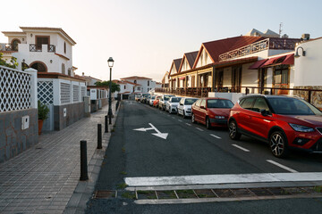 typical white washed holiday rent house in Canary islands near ocean, street view