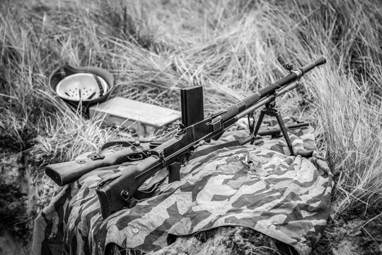 A machine gun ZB vs. 26 in the grass at a firing point of Czech production. World War II Black and white photography