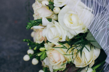 Wedding bouquet of white roses, white berries and protea