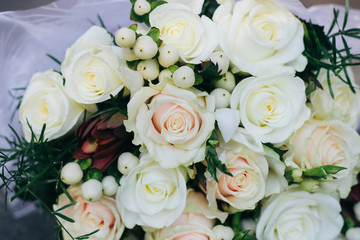 Wedding bouquet of white roses, white berries and protea