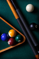 Pool table with cues, rack and balls