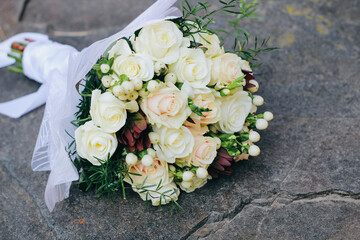 Wedding bouquet of white roses, white berries and protea