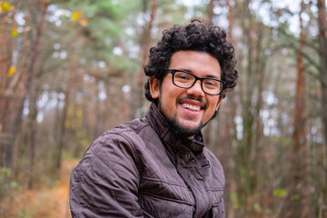 portrait of a man in autumn park