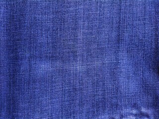 Closeup jeans fabric texture. Denim jeans background.