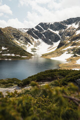 View of The Twin Lake at Seven Rila Lakes covered with snow during early summer day at Rila Mountain (near Sofia, Bulgaria, Europe)