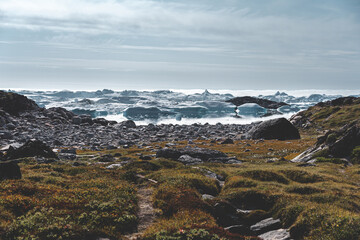 View towards Icefjord in Ilulissat. Easy hiking route to the famous Kangia glacier in Greenland. The Ilulissat Icefjord seen from the viewpoint. Declared a UNESCO World Heritage Site in 2004.