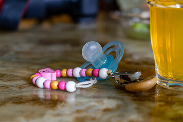 Pacifier with pacifier chain on a table