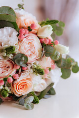 Wedding flowers, bridal bouquet closeup. Decoration made of roses, peonies and decorative plants