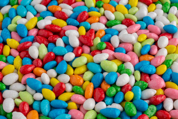 Fototapeta na wymiar Vivid background of many candies in multi-colored glaze