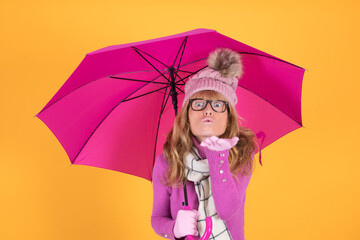 adult woman sheltered with umbrella and colored background