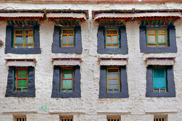 White walls and colorful windows of the Sera Monastery in Lhasa, Tibet.