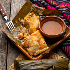 Mexican tamales wrapped in banana leaves also called 