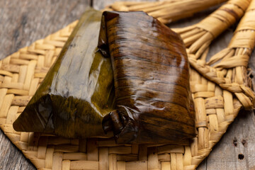 Mexican tamales wrapped in banana leaves also called 