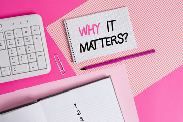 Writing note showing Why It Matters Question. Business concept for most important thing to be done when involved in situation Writing equipments and computer stuffs placed above colored plain table