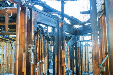 Burnt black house after fire damaged interior details arson from a home - obrazy, fototapety, plakaty