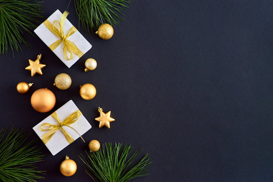 Flat Lay Border With Gold Christmas Balls And Gift Box On A Dark Background