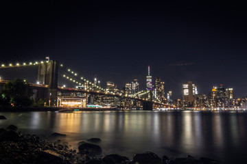Fototapeta na wymiar Night view of Brooklyn bridge and Skyscrapers in New York