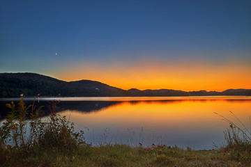 view of the Lac-Superieur, in Laurentides, Mont-Tremblant, Quebec, Canada, during the Indian summer at sunset