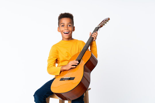 African American boy  with guitar over isolated white background