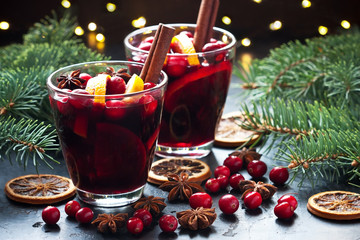 Christmas hot drink in glass and  fir tree branches