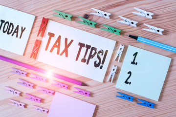 Handwriting text writing Tax Tips. Conceptual photo compulsory contribution to state revenue levied...