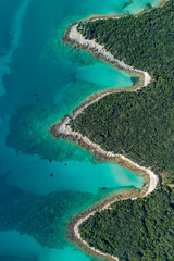 Aerial view of sea and beach in a lagoon on Cres ( isola Cherso )  Island Croatia, close to Punta Kriza ( Punta Croce ). It is a part of national where rocks and sand and forest merge on a coast. 