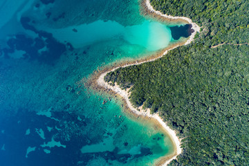 Aerial view of sea and beach in a lagoon on Cres ( isola Cherso )  Island Croatia, close to Punta Kriza ( Punta Croce ). It is a part of national where rocks and sand and forest merge on a coast. 