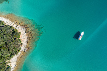 Aerial view of sea and beach in a lagoon on Cres ( isola Cherso )  Island Croatia, close to Punta Kriza ( Punta Croce ). It is a part of national where rocks and sand and forest merge on a coast. 