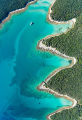 Aerial view of sea and beach in a lagoon on Cres ( isola Cherso ) Island Croatia, close to Punta Kriza ( Punta Croce ). It is a part of national where rocks and sand and forest merge on a coast. 