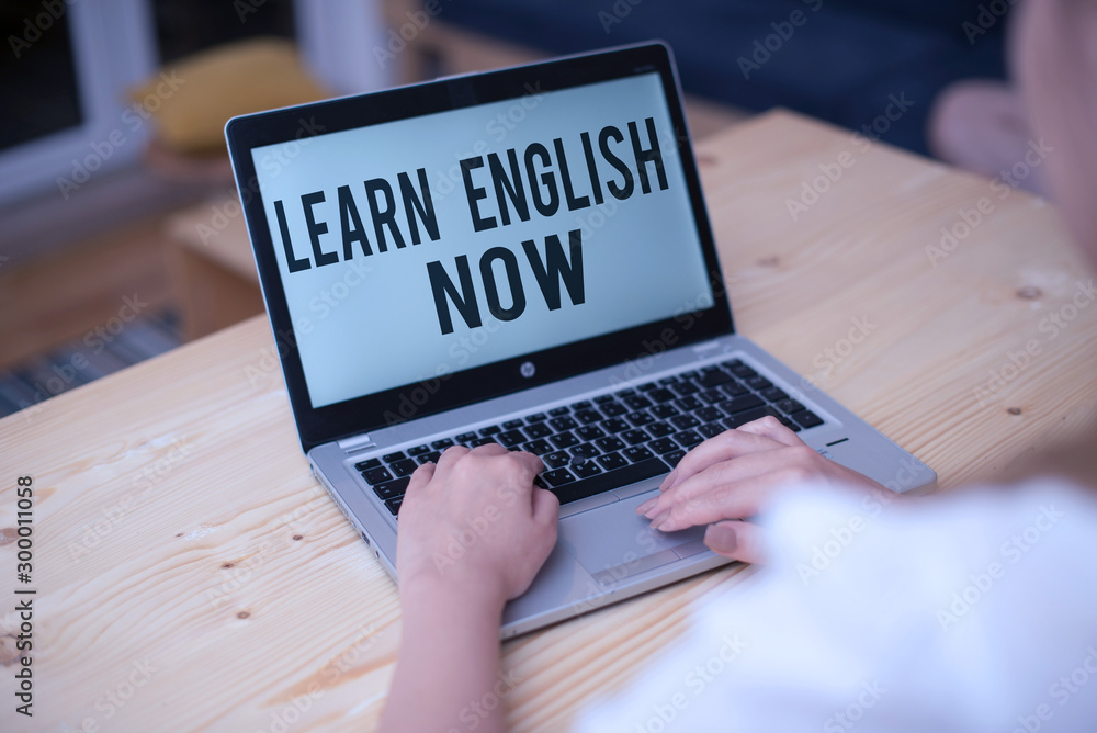 Poster writing note showing learn english now. business concept for gain or acquire knowledge and skill of 