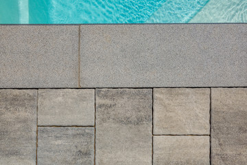 A natural stone. Facing tiles. Paving slabs. Granite. Marble. Crushed stone Texture. Terrace. The territory near the pool. Material. Limestone.
