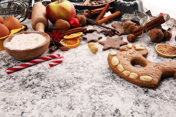 Baking christmas cookies. Typical cinnamon stars bakery with spices. xmas decoration on table