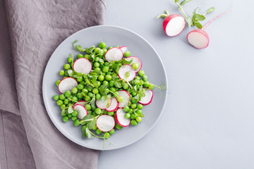 fresh salad with radishes and peas for spring menu