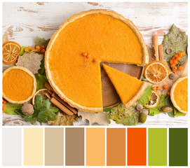 Composition with tasty pumpkin pie on wooden background. Different color patterns