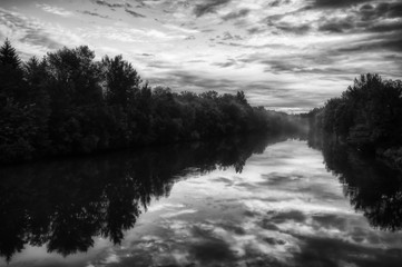 Foggy and cloudy view over a river