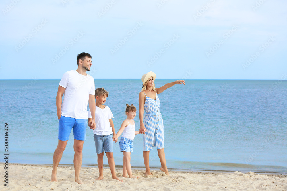 Sticker Happy family walking on sea beach