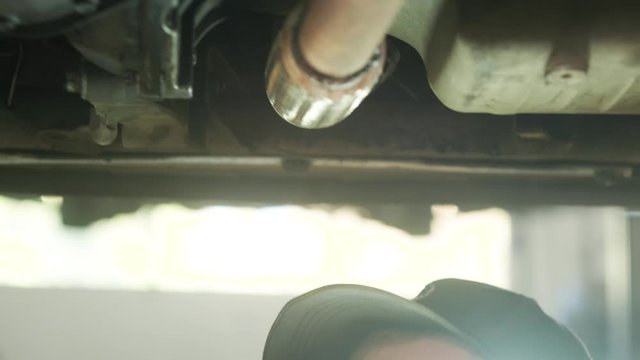 car service, repair, maintenance and people concept - auto mechanic man with lam