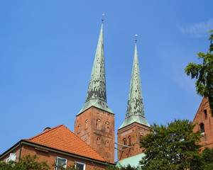 Fototapeta na wymiar Close-up view of the two towers of the Lübeck Cathedral. Lubeck is the famous tourist destination in Schleswig-Holstein, northern Germany. UNESCO World Heritage