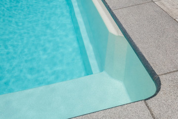 Obraz premium Part of the pool close-up, abstract geometry of the pool, fragments and details of the pool, pool bowl, top view, shape, lines.