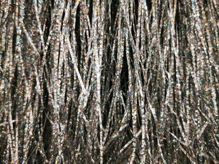 Obraz premium Beautiful tinsel, great design for any purposes. New year card. Bright tinsel, Christmas background, shiny pattern. Colorful decoration.