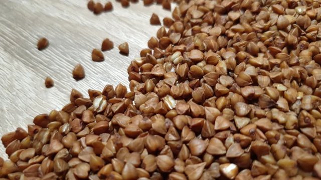 Buckwheat. Buckwheat kernels. Buckwheat close-up. Dietary grits.