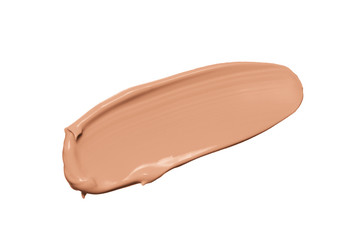 Makeup foundation texture, beige concealer swatch smudge smear isolated on white background. Nude makeup base swipe